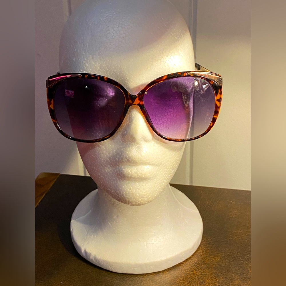 Like New Betsey Johnson large sunglasses,metal w/tortoise accents,purple lenses.